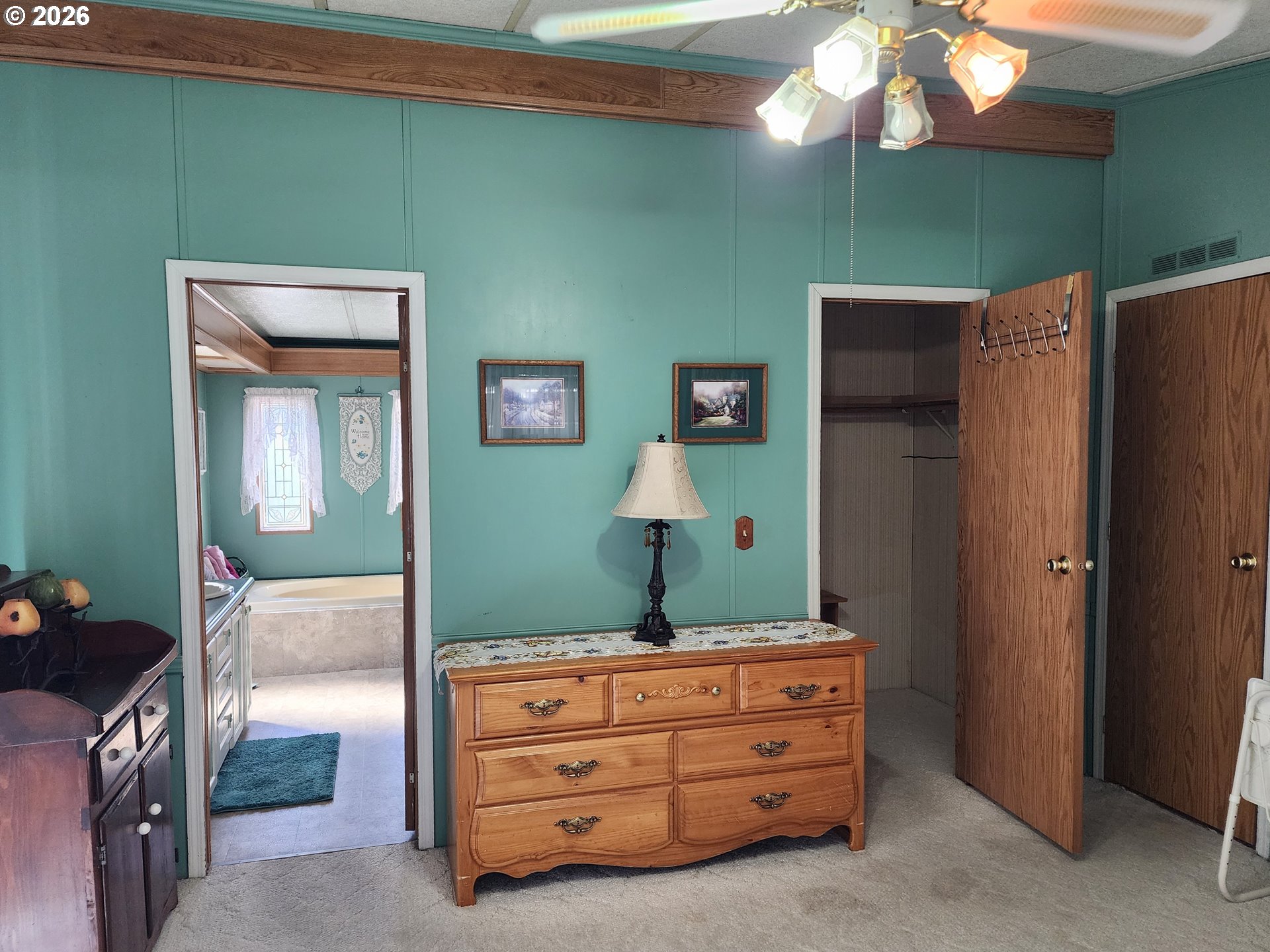 5422 Portland Road Northeast Salem, OR 97305 - Photo 10 of 14 a room that has a mirror and a dresser in it