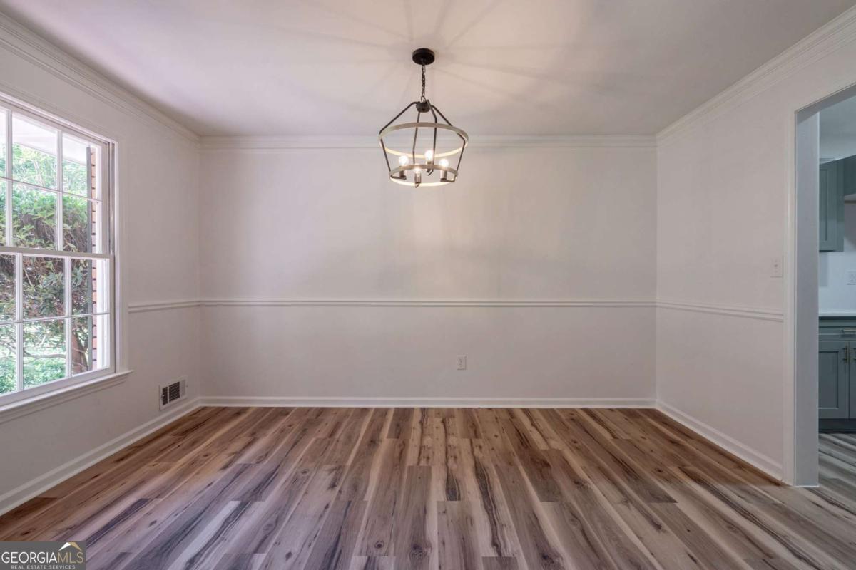400 Sandstone Drive Athens, GA 30605 - Photo 11 of 41 a view of a room with wooden floor cabinets and a window