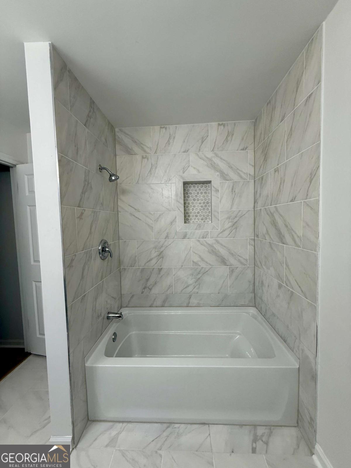 400 Sandstone Drive Athens, GA 30605 - Photo 19 of 41 a bath tub sitting next to a white sink