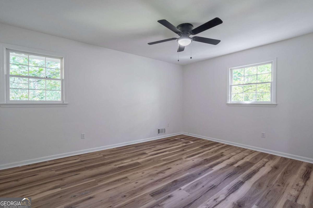 400 Sandstone Drive Athens, GA 30605 - Photo 21 of 41 a view of empty room with wooden floor