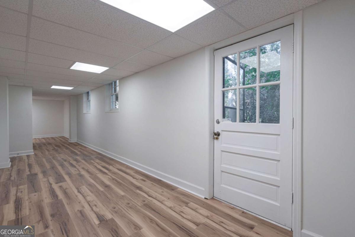 400 Sandstone Drive Athens, GA 30605 - Photo 26 of 41 a view of empty room with wooden floor and fan