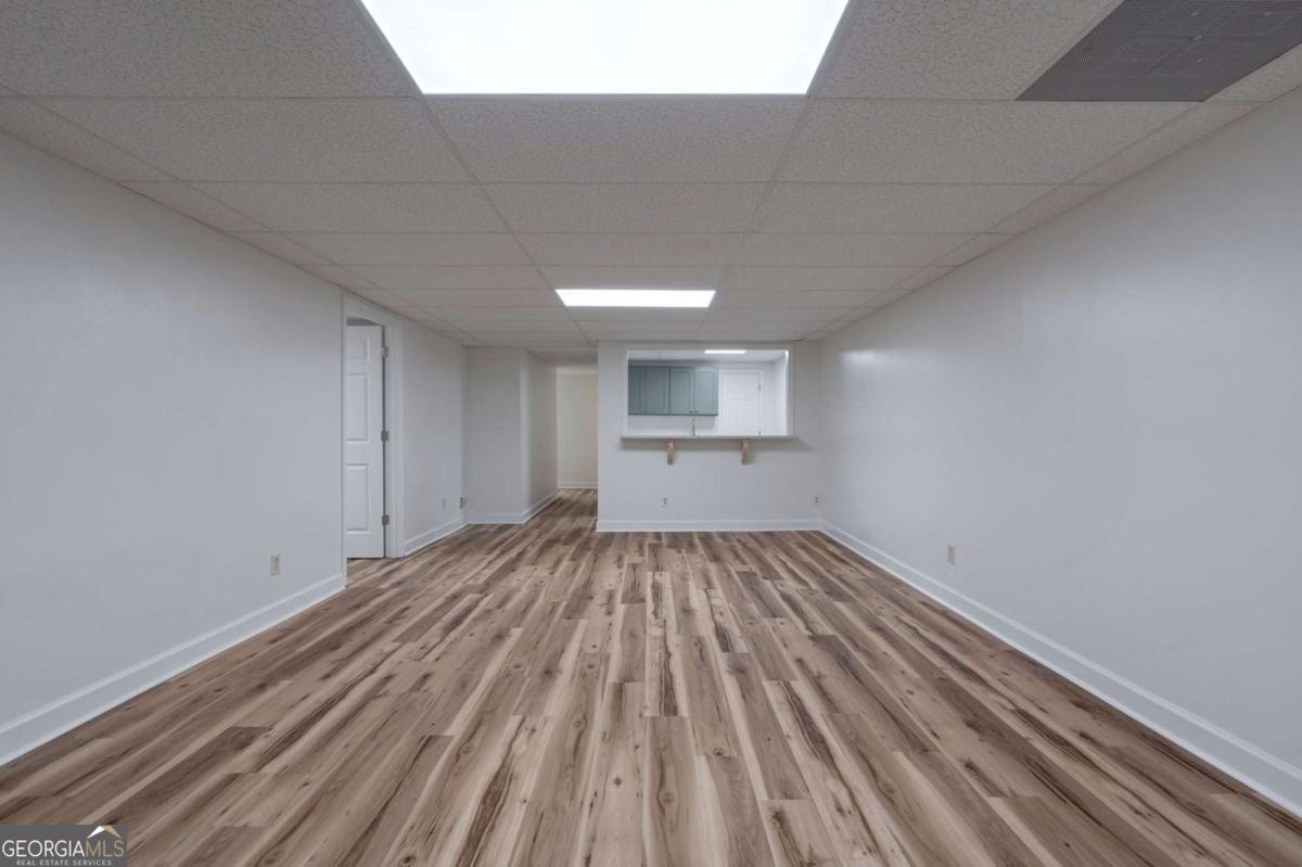 400 Sandstone Drive Athens, GA 30605 - Photo 29 of 41 a view of empty room with wooden floor