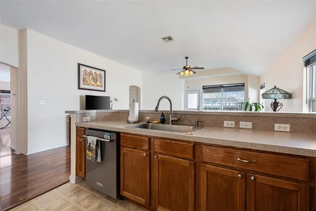 a kitchen with a stove and a sink
