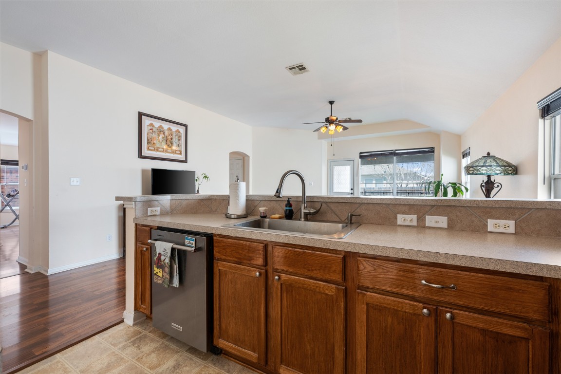 221 Stone Crest Boulevard Buda, TX 78610 - Photo 12 of 33 a view of cabinets a sink and a window