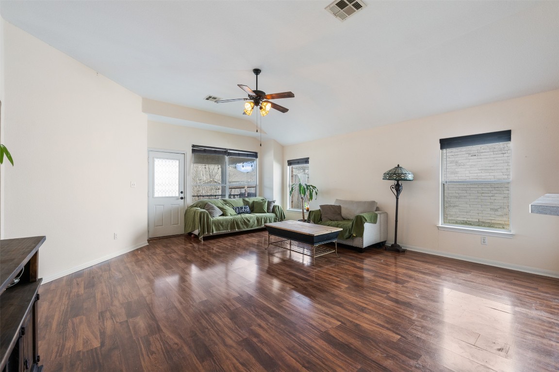 221 Stone Crest Boulevard Buda, TX 78610 - Photo 13 of 33 a living room with furniture and a chandelier