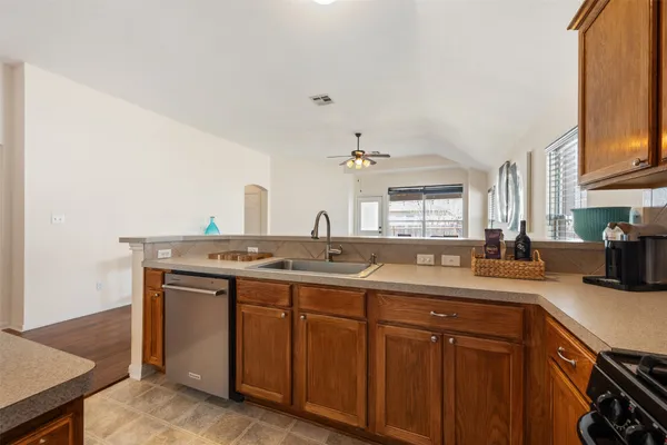 a kitchen with a sink stove and microwave