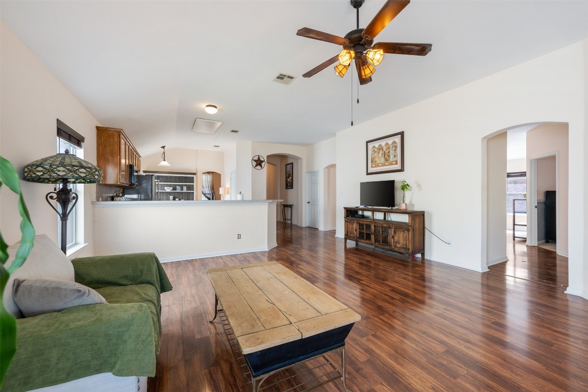 221 Stone Crest Boulevard Buda, TX 78610 - Photo 16 of 33 a living room with furniture and kitchen view