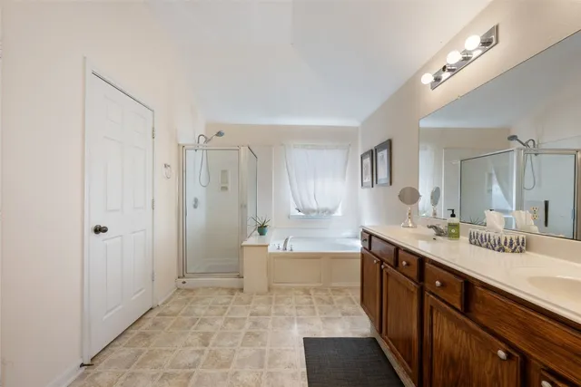 a bedroom with a bed and a television