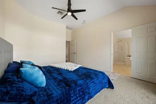 a bedroom with furniture and a window