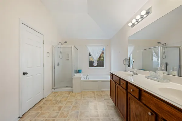 a bedroom with a bed and cabinets