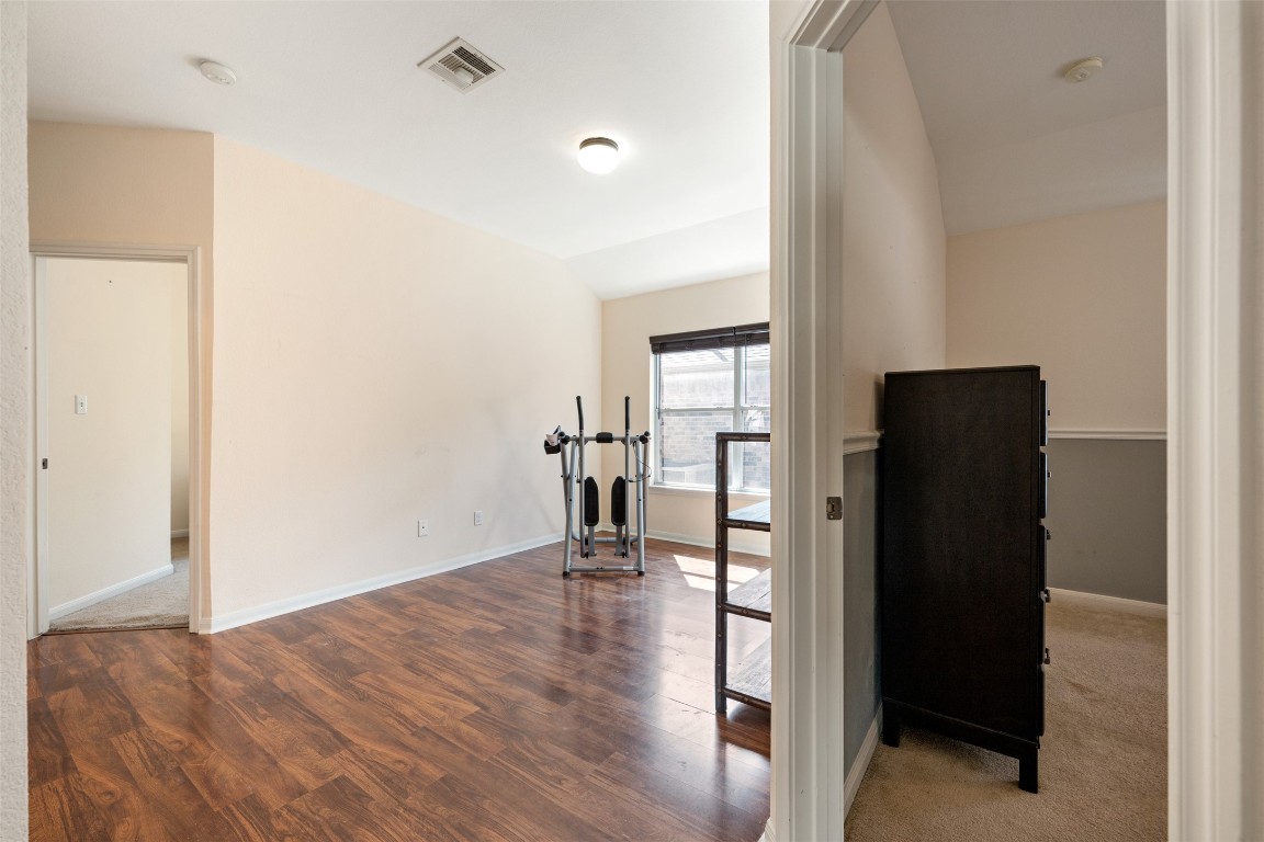 221 Stone Crest Boulevard Buda, TX 78610 - Photo 24 of 33 wooden floor in an empty room