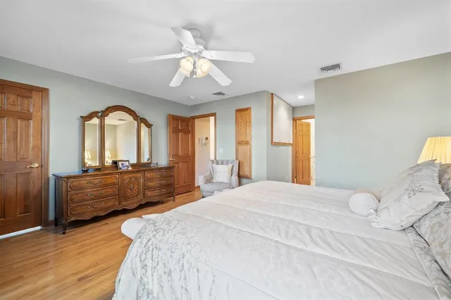 a bedroom with a bed and a couch