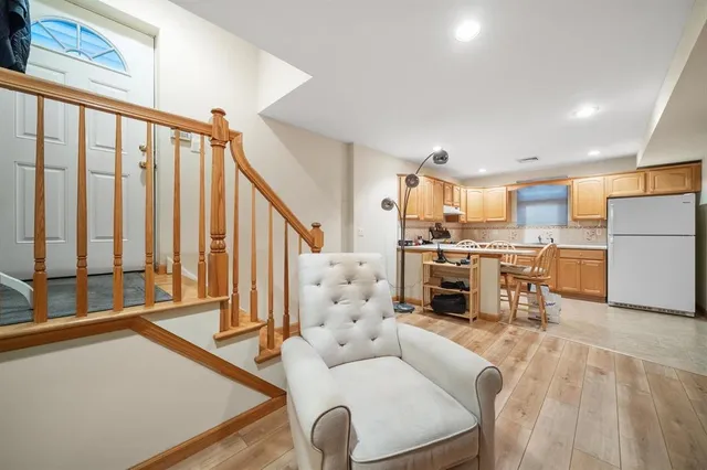 a kitchen with stainless steel appliances a stove a sink cabinets and a window