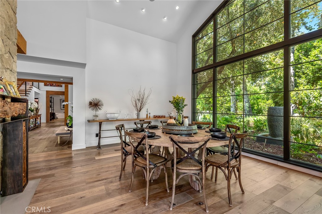 5207 Saddle Creek Road Hidden Hills, CA 91302 - Photo 11 of 54 a view of a dining room with furniture and wooden floor