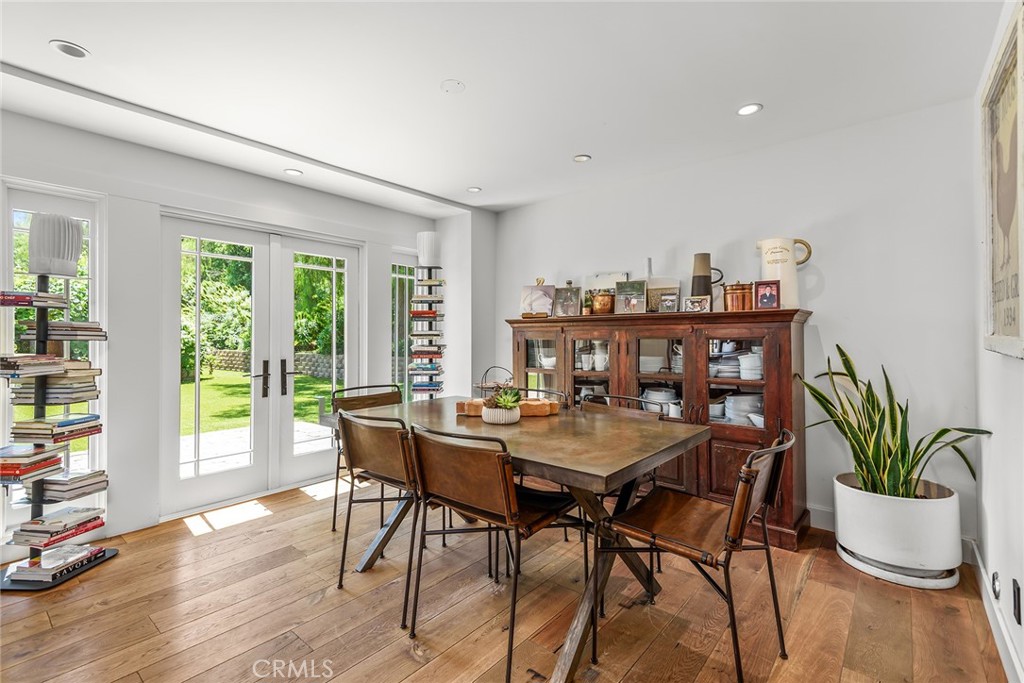 5207 Saddle Creek Road Hidden Hills, CA 91302 - Photo 12 of 54 a view of a dining room with furniture window and wooden floor