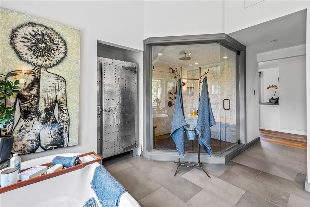 5207 Saddle Creek Road Hidden Hills, CA 91302 - Photo 25 of 54 a view of a hallway with workspace and mirror