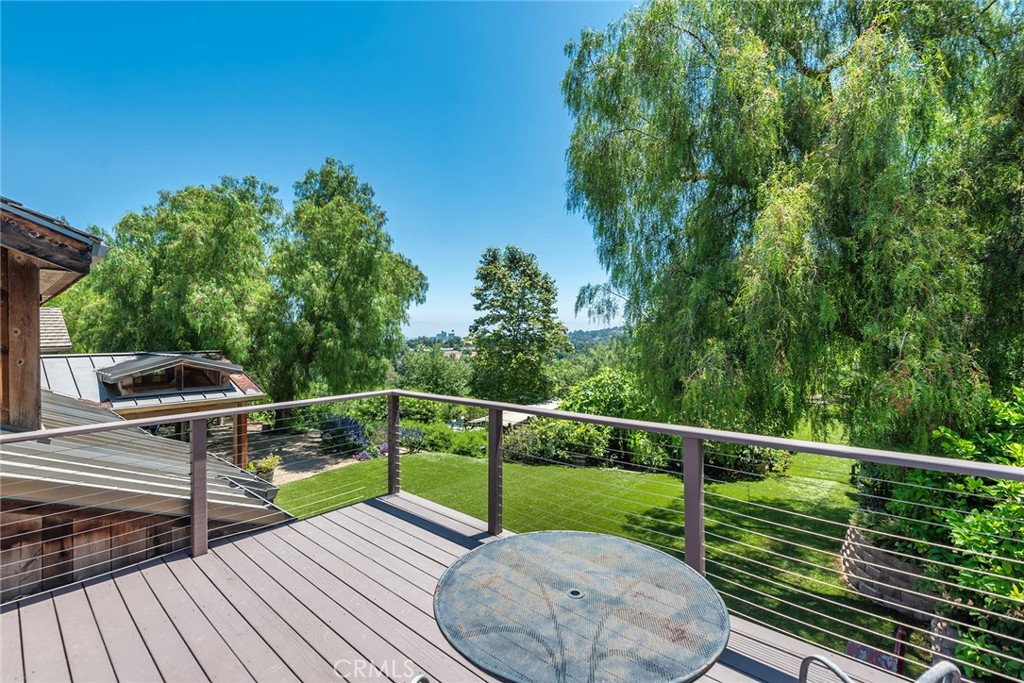 5207 Saddle Creek Road Hidden Hills, CA 91302 - Photo 27 of 54 a view of balcony with deck and outdoor seating