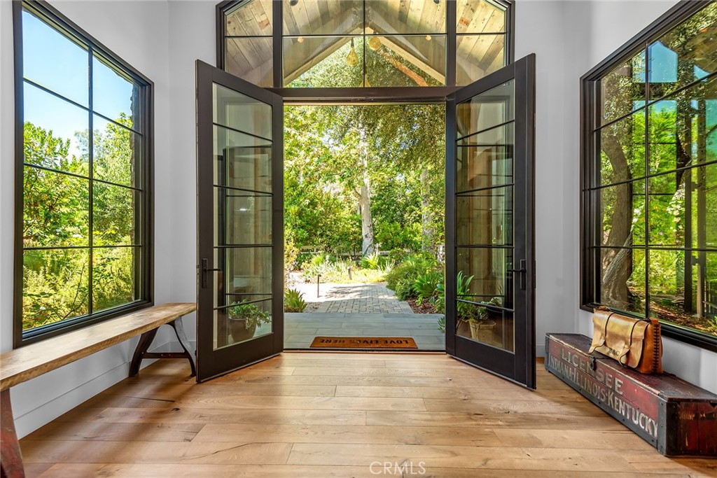 5207 Saddle Creek Road Hidden Hills, CA 91302 - Photo 4 of 54 a view of an entryway with a floor to ceiling window