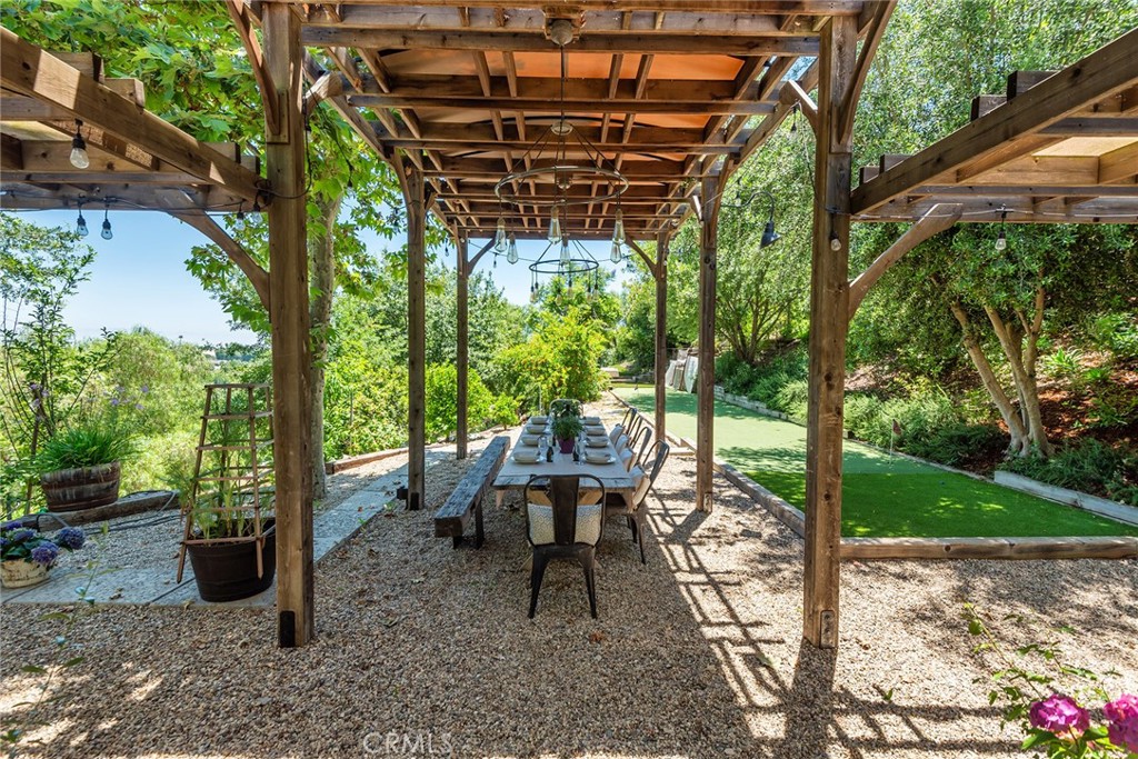 5207 Saddle Creek Road Hidden Hills, CA 91302 - Photo 42 of 54 a view of a chairs and table in patio