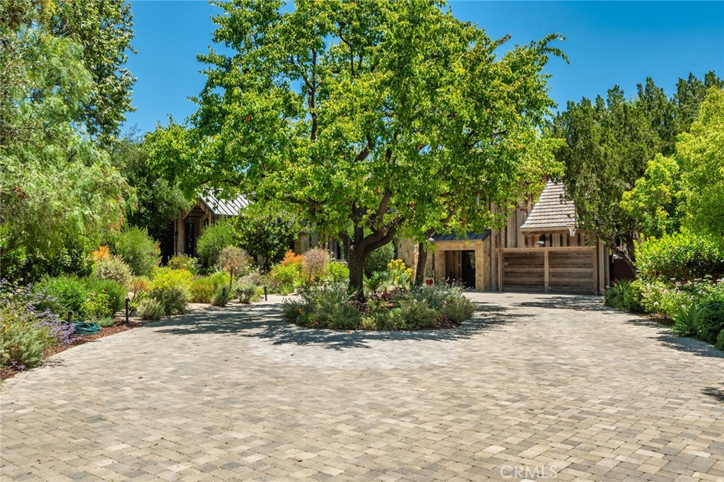 5207 Saddle Creek Road Hidden Hills, CA 91302 - Photo 50 of 54 front view of a house with a yard