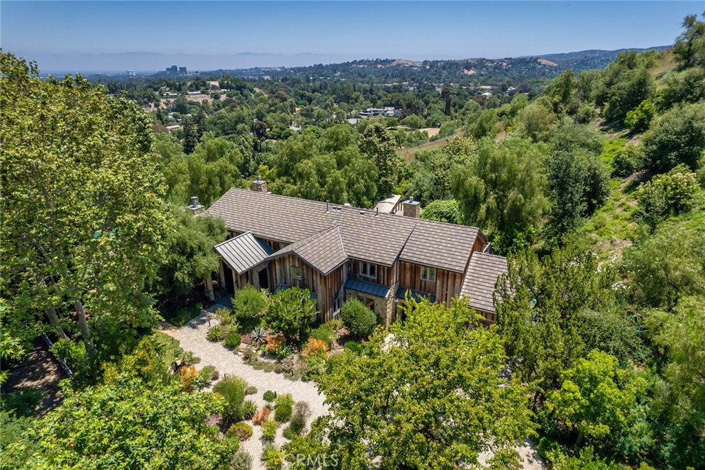 5207 Saddle Creek Road Hidden Hills, CA 91302 - Photo 52 of 54 an aerial view of a house with a yard and large tree