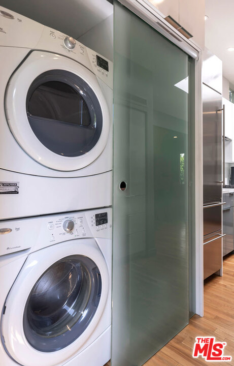 9831 Easton Drive Beverly Hills, CA 90210 - Photo 13 of 27 a utility room with dryer and washer