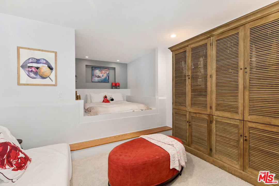 9831 Easton Drive Beverly Hills, CA 90210 - Photo 20 of 27 a bed room with a bed and a chair