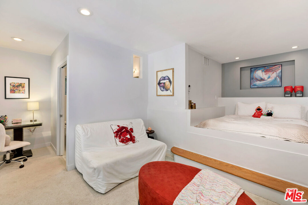 9831 Easton Drive Beverly Hills, CA 90210 - Photo 21 of 27 a bedroom with a bed and a workspace