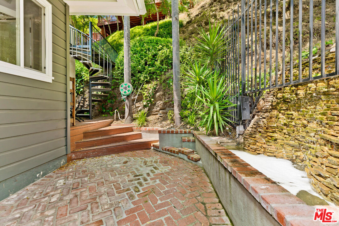 9831 Easton Drive Beverly Hills, CA 90210 - Photo 23 of 27 a bathroom with a bathtub and shower