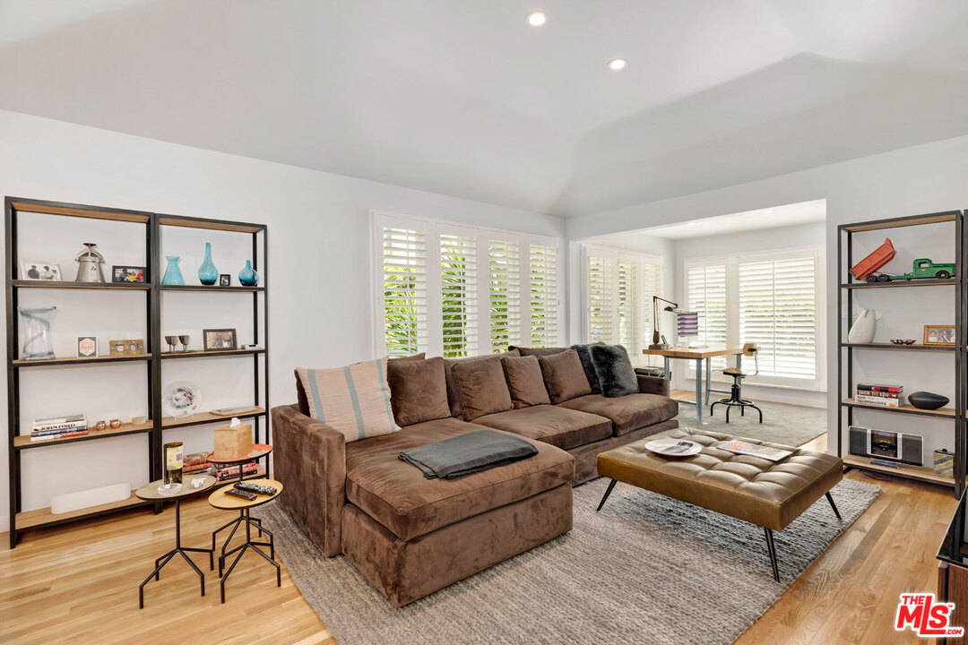 9831 Easton Drive Beverly Hills, CA 90210 - Photo 5 of 27 a living room with furniture a rug and a window