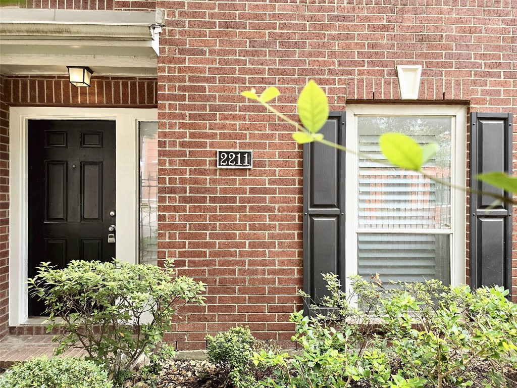 2211 Runnels Street Houston, TX 77003 - Photo 16 of 17 a view of a door with brick wall