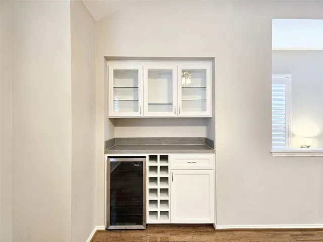 a view of a kitchen with a sink and a window
