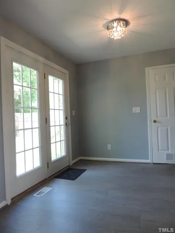 an empty room with a empty space and a window