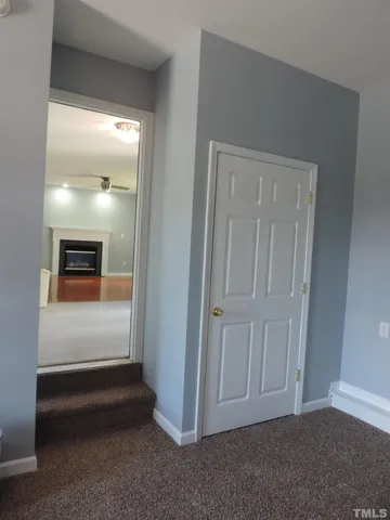 an empty room with wooden floor