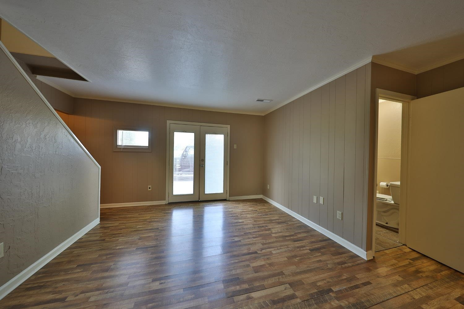 707 Baker Road Martin, TN 38237 - Photo 13 of 32 a view of an empty room with window and wooden floor