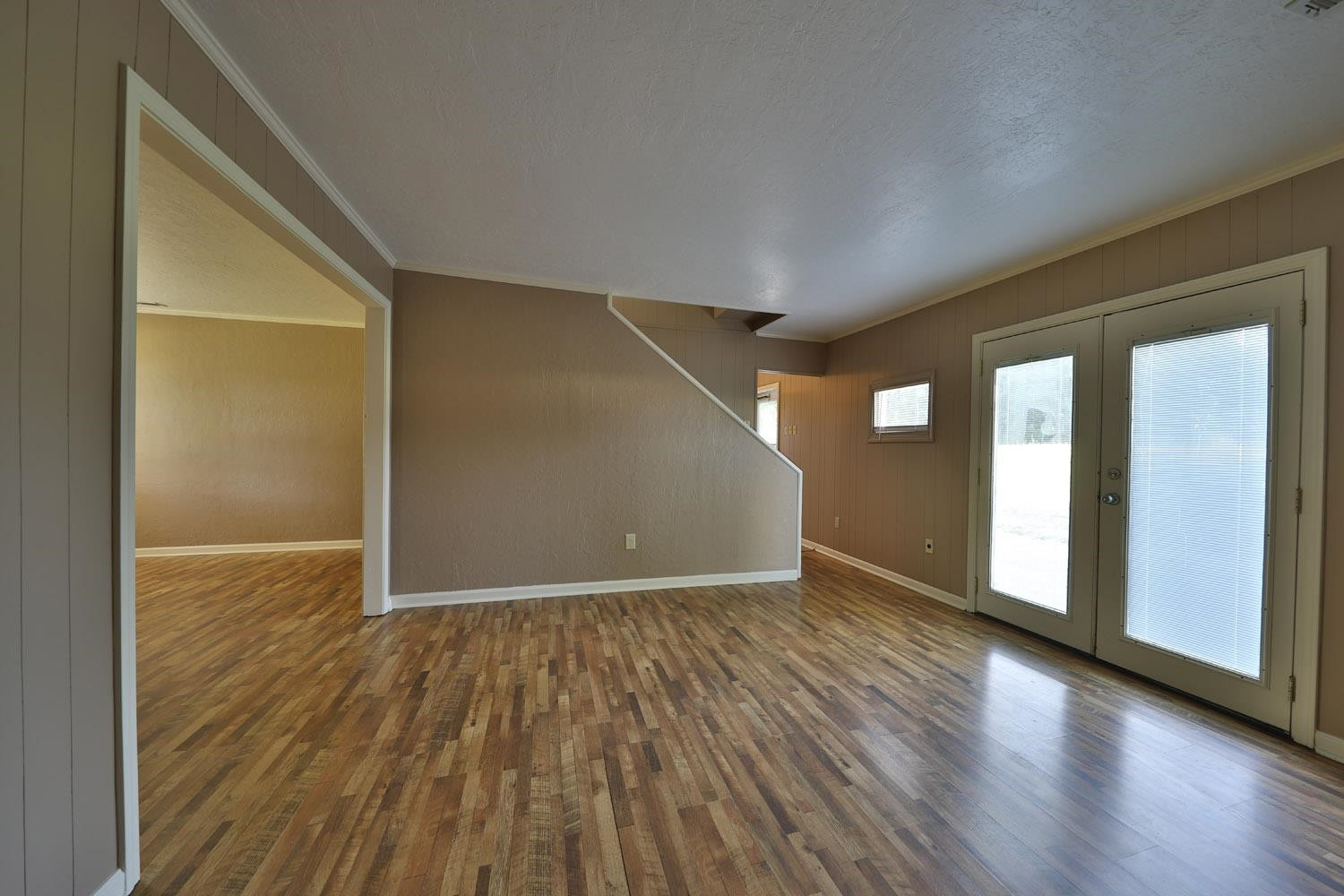 707 Baker Road Martin, TN 38237 - Photo 14 of 32 a view of an empty room with wooden floor and a window