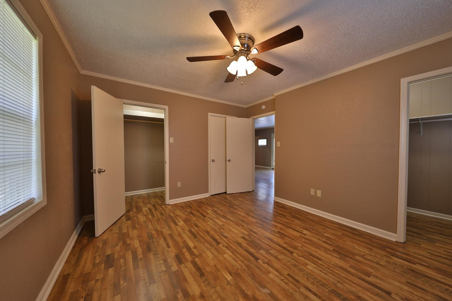 707 Baker Road Martin, TN 38237 - Photo 17 of 32 a view of an empty room with wooden floor and a window