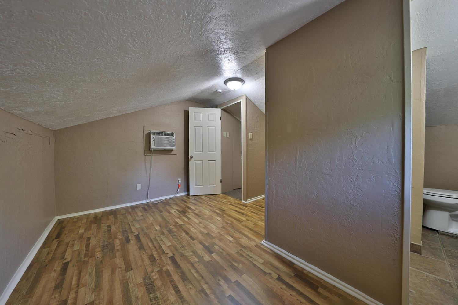707 Baker Road Martin, TN 38237 - Photo 23 of 32 a view of empty room with wooden floor
