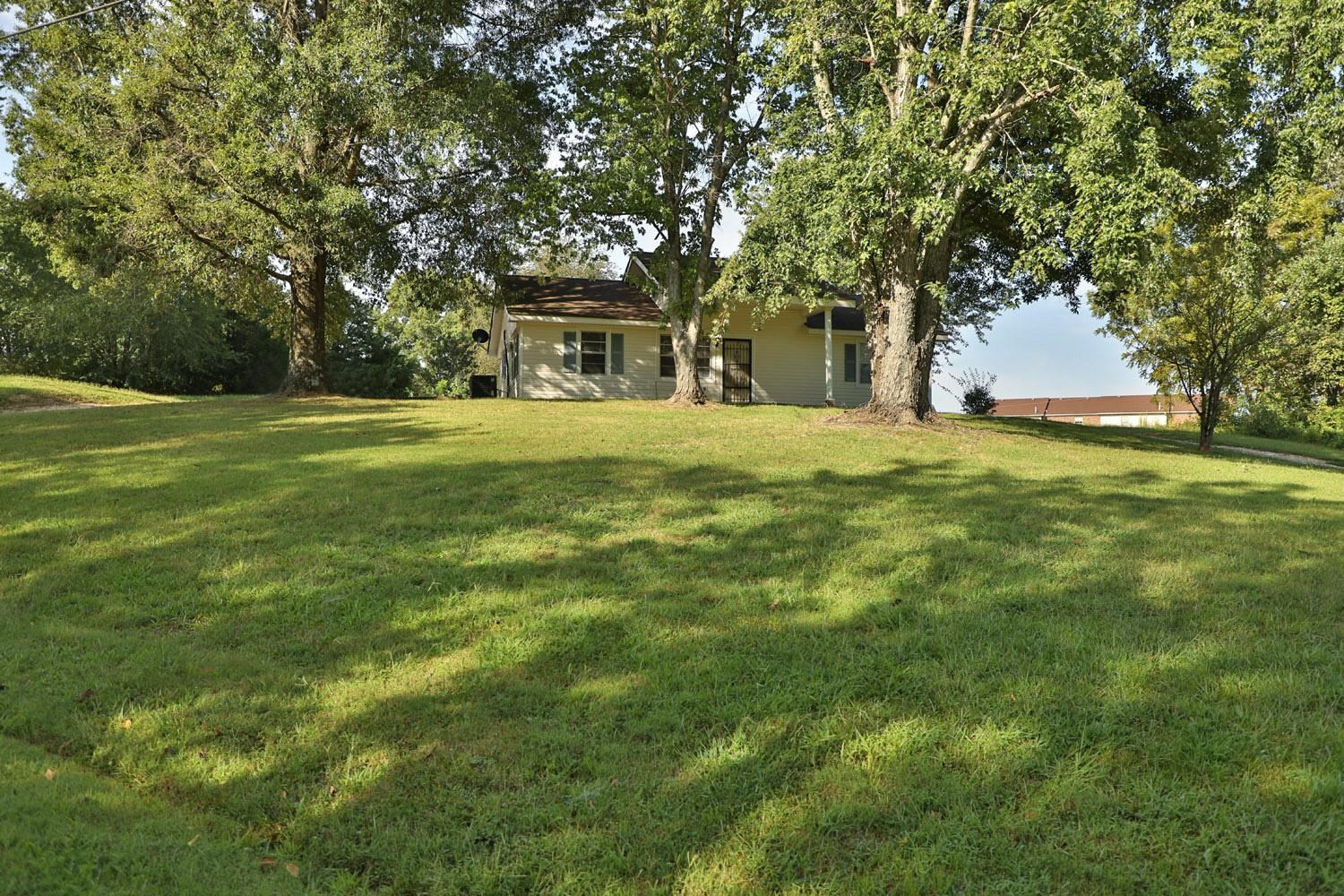 707 Baker Road Martin, TN 38237 - Photo 3 of 32 a front view of a house with a garden