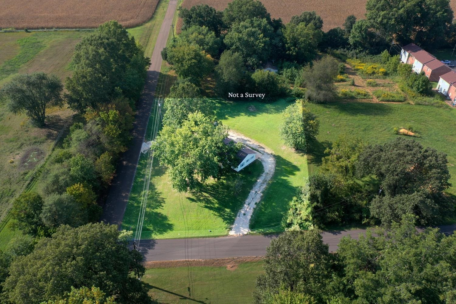 707 Baker Road Martin, TN 38237 - Photo 31 of 32 an aerial view of a house with a yard and lake view