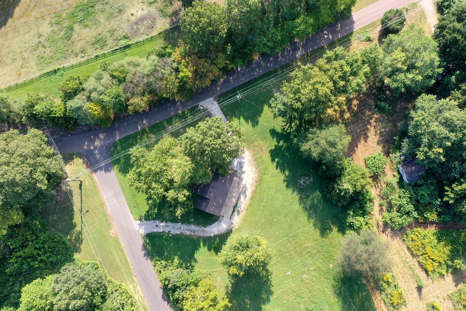 707 Baker Road Martin, TN 38237 - Photo 32 of 32 an aerial view of a yard with plants and large trees
