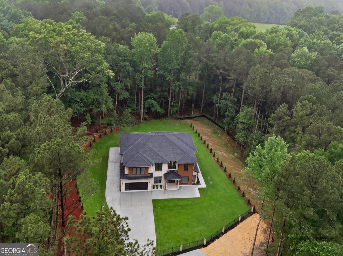 1563 Whitley Road Bethlehem, GA 30620 - Photo 42 of 44 an aerial view of a house with swimming pool and garden