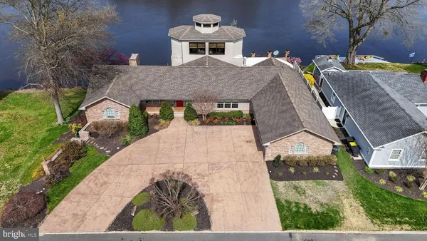 a aerial view of a house with a yard