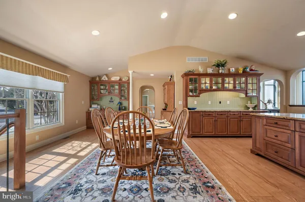 a kitchen with stainless steel appliances granite countertop a sink and stove
