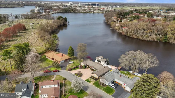 an aerial view of a house with a lake view