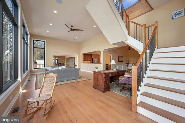 a view of a livingroom with furniture and a kitchen