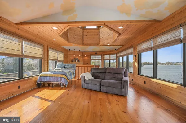 a bedroom with a bed and a furniture