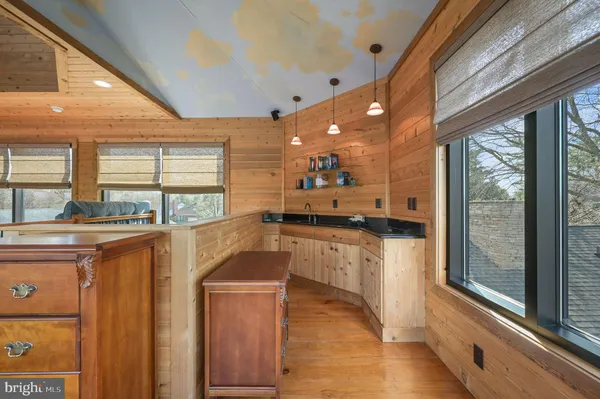 a bathroom with a double vanity sink mirror and shower