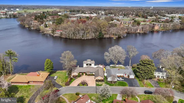 an aerial view of a house with a lake view