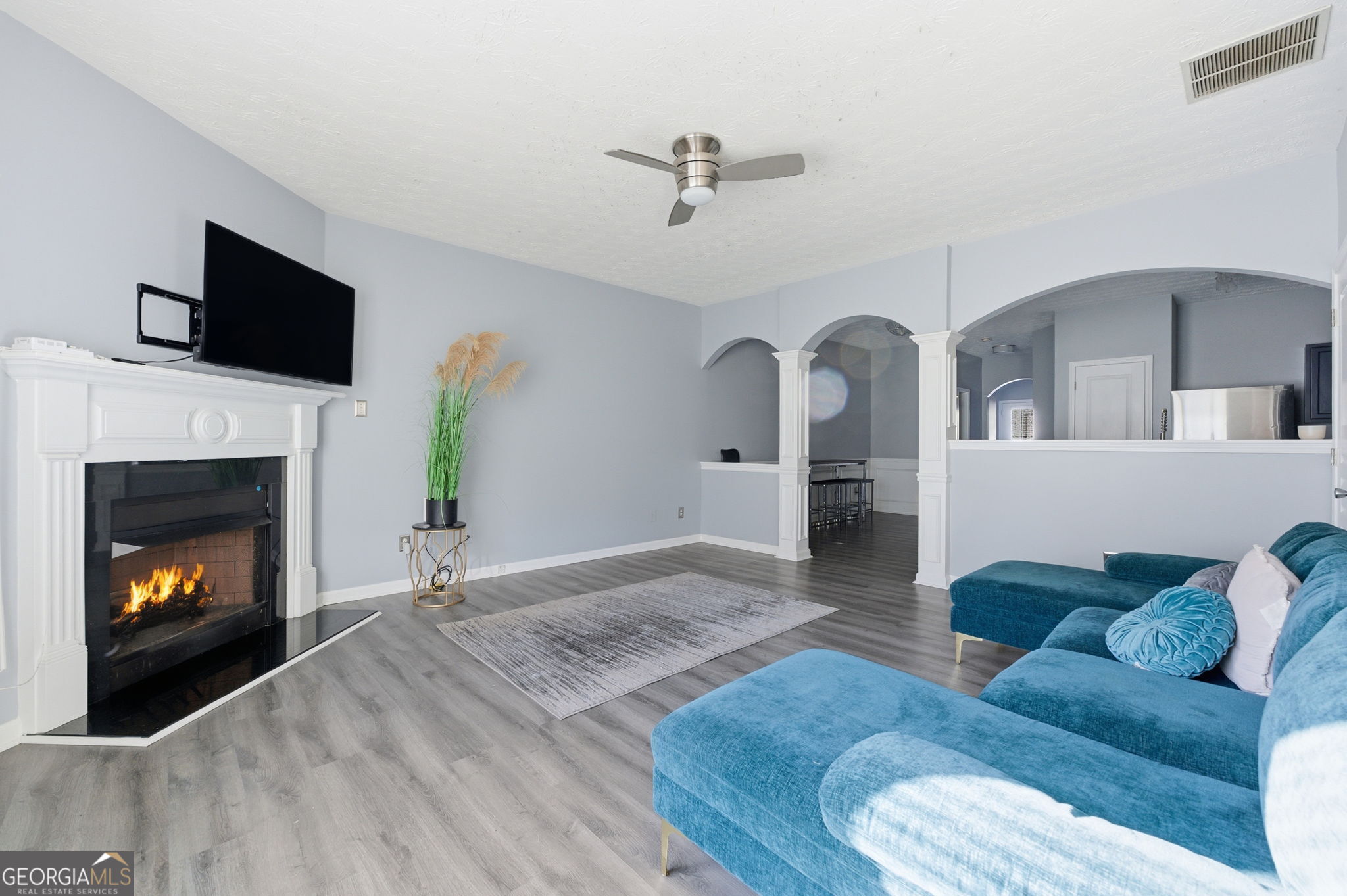 6022 Centennial Run Atlanta, GA 30349 - Photo 12 of 23 a living room with furniture and a fireplace